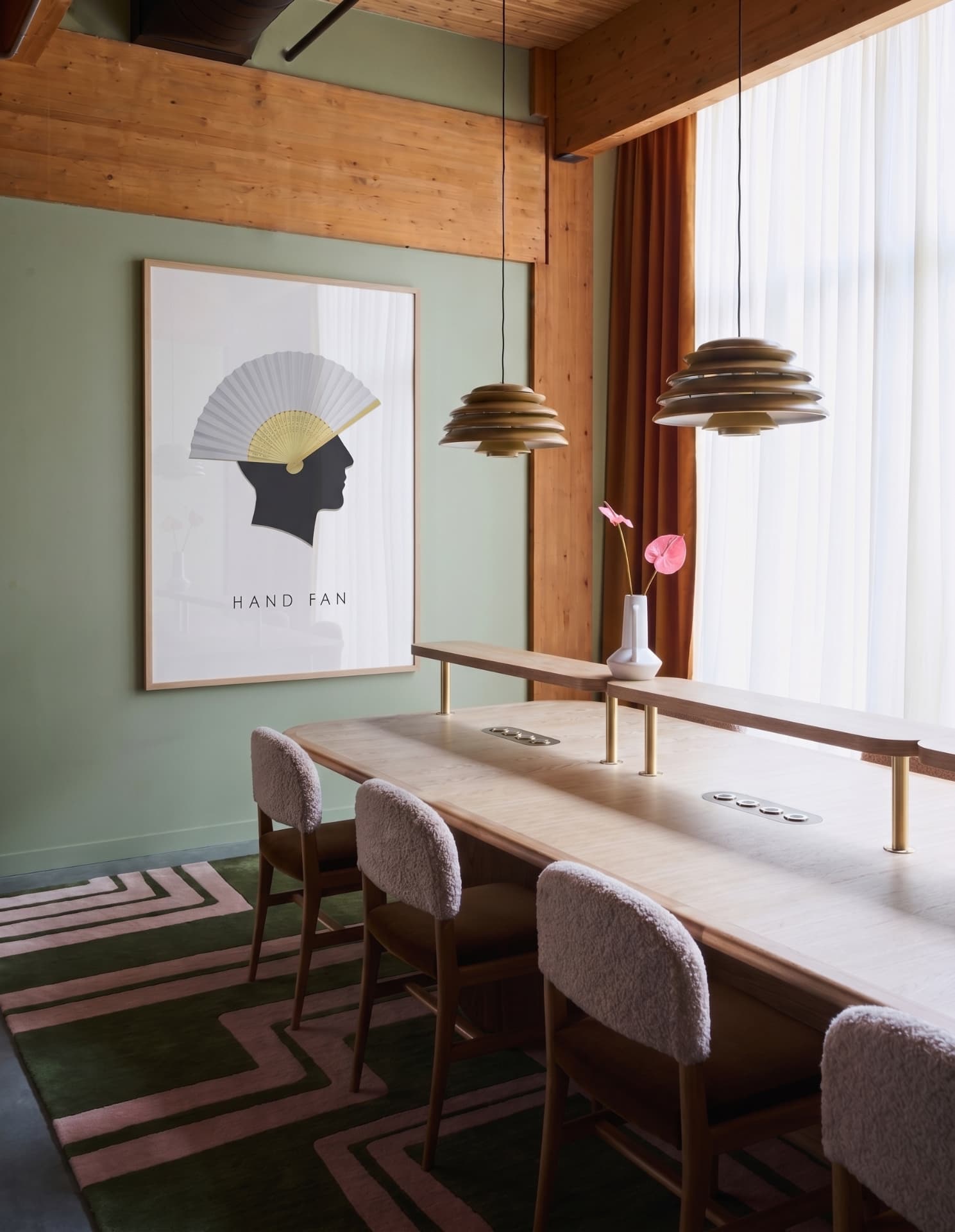 HAND FAN — in a room